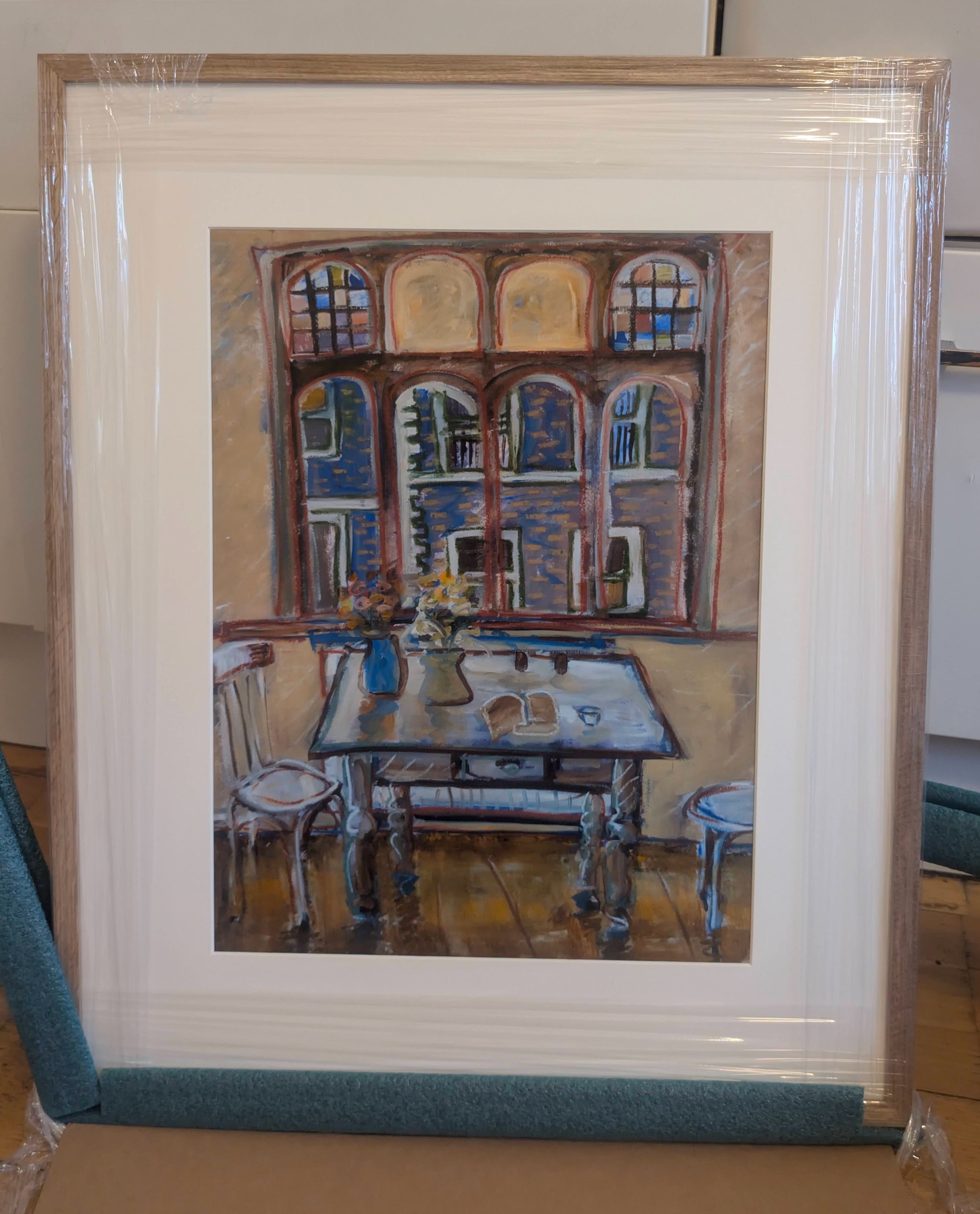Framed painting of a room with a table and chairs.